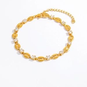 Detail of 18k gold plated hollow cuban link bracelet with clear cubic zirconia stones