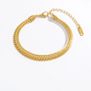 Detailed close-up of 18k gold plated stainless steel wheat link bracelet with lobster clasp