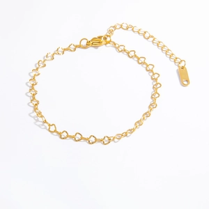 Close-up of 18k gold-plated stainless steel bracelet featuring hollow heart-shaped links