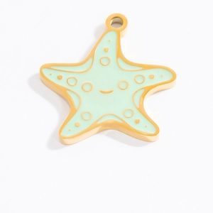 Detail of starfish pendant with green enamel smiley face and gold-plated finish