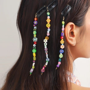 Kleurrijke kralen haarextensie clips met bloemen en smileys voor trendy kapsels