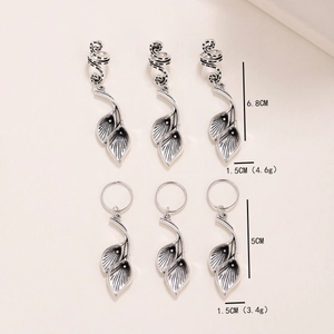 Vintage silver spiral hair rings with calla lily leaf pendants and retro metal textures