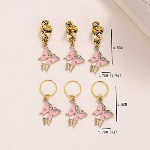 Pink enamel butterfly hair rings with gold spirals and crystals for festive styling