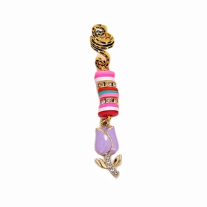 Golden spiral hair ring with colorful clay beads and a purple tulip pendant charm