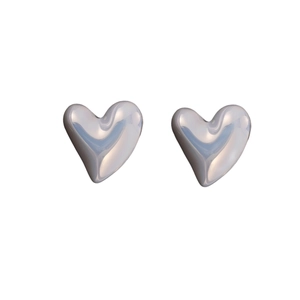 Detail of 3D irregular heart stud earrings with silver liquid metal finish and luster