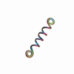 Macro view of iridescent metallic Celtic hair spiral with rainbow plated finish