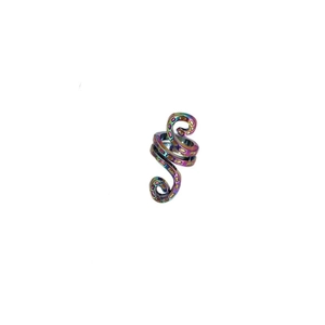 Macro detail of Celtic spiral hair clip featuring iridescent finish and textured surface