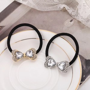 Sparkling rhinestone heart bow hair ties in gold and silver finish with elastic band