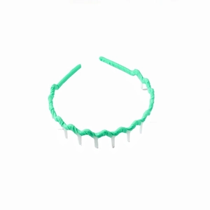 Detailed view of neon green wavy headband with anti-slip teeth and fabric wrapped texture