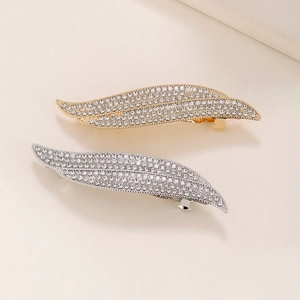 Elegant rhinestone leaf hair clip in gold and silver finish with crystal spring clasp