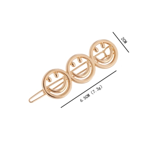 Goldene Barock-Haarklammer mit drei hohlen Smiley-Gesichtern und poliertem Finish