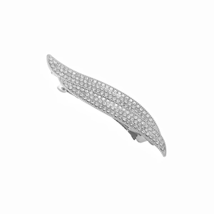 Detailed macro view of leaf-shaped hair clip with sparkling rhinestones and silver finish