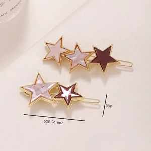 Barrettes étoile en métal doré avec inserts en résine marbrée rose et violette
