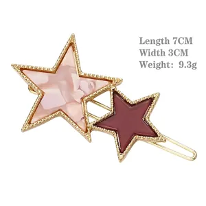 Barrette à cheveux étoile avec marbrure rose et résine rouge sur métal doré