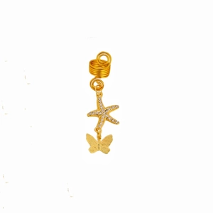 Detailed view of gold butterfly and star dreadlock charms with crystal accents