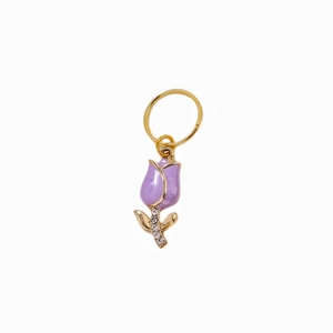 Detail of purple tulip alloy pendant with gold plating and cubic zirconia inlay