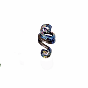Detailed macro view of iridescent octopus tentacle hair clip with suction cup textures