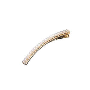 Elegant gold hair clip with pearls and rhinestones on a clean white background
