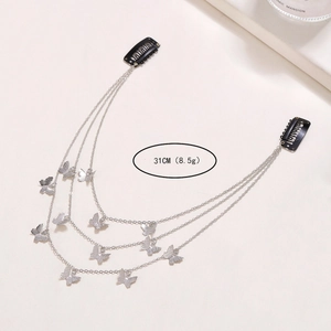 Detail view of a 31cm multi-layer butterfly hair chain with black metal BB clips