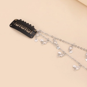 Y2K style black hair clip with long silver chain tassels and sparkling rhinestones