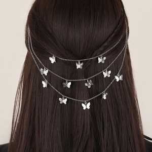 Silver multi-layer butterfly fringe hair chain with embossed metal charms on dark hair