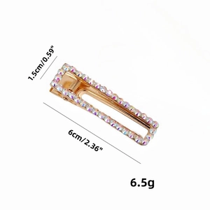 Golden alloy rectangular hair clip with shimmering rainbow rhinestones, size 6cm by 1.5cm