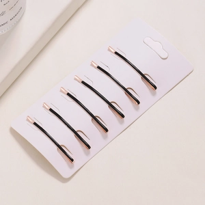 Set of 6 minimalist black and rose gold hair clips on a white display card for women