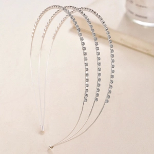 Detail view of four silver minimalist headbands with sparkling pave rhinestones