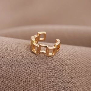 Minimalist gold U-shaped square chain ear cuff for non-pierced ears on fabric