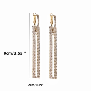 Sparkly rhinestone rectangle drop earrings in gold finish with 9x2 cm dimensions