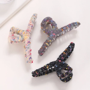 Three colorful yarn wrapped hair claw clips in autumn winter plush knit styles