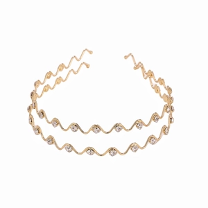 Detailed macro view of the double-layered golden wave headband with sparkling rhinestones