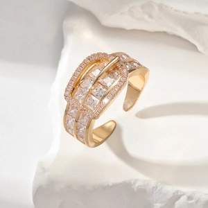 Detail of gold belt buckle ring with square cubic zirconia and pave diamonds