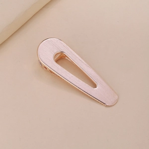 Hollow teardrop duckbill hair clip in rose gold alloy with a brushed metal texture