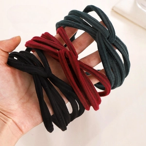 Three-pack ribbed knit knotted headbands in black, burgundy and dark green colors