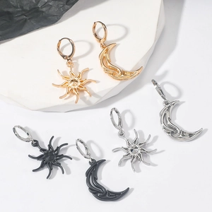 Minimalist asymmetric sun and moon earrings in gold, silver, and matte black finish