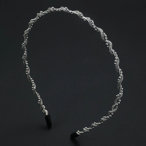 Elegant bridal silver headband with twisted wire design and tiny metal bead accents