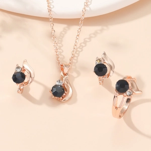 Elegant rose gold jewelry set with dark blue zircons including necklace, earrings, and ring