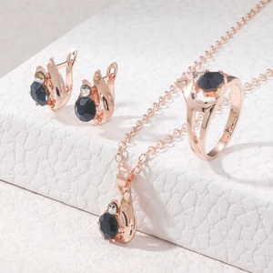 Elegant rose gold jewelry set with deep blue gemstones for bridal and banquet wear