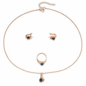 Detail of rose gold jewelry set with navy blue stones and crystal accents