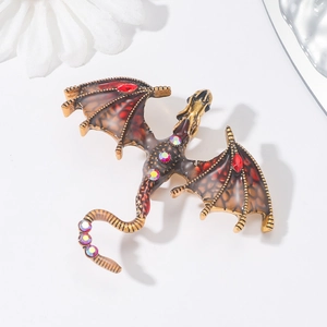 Vintage gold dragon brooch with red wings and crystals for suits and coats