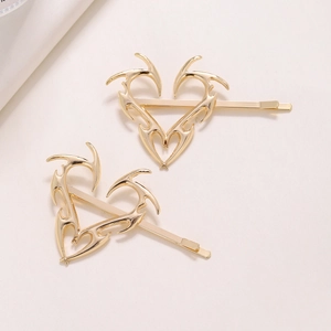 Vintage gold Y2K aesthetic heart hairpins with spiky edges and polished finish