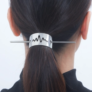 Polished silver metal lightning hair pin with hollow wave design shown on a ponytail