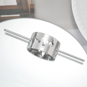Detail view of silver hollow lightning hair pin on a reflective mirror surface