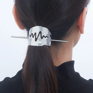Polished silver metal hair pin with electrocardiogram wave design on black hair ponytail