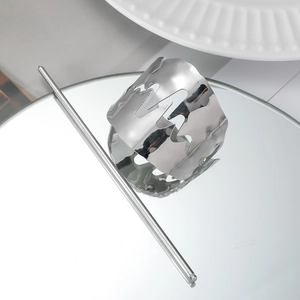 Close-up of minimalist silver metal hair pin with lightning hollow design.