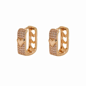 Detail view of gold-plated rectangular earrings featuring crystal pavé and heart cut-outs