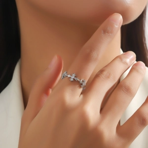 Vintage silver cross ring with cubic zirconia stars in a minimalist geometric style