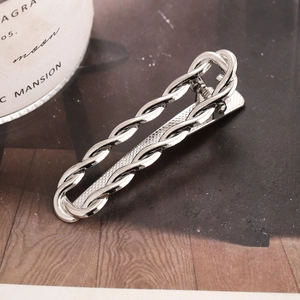 Modern twisted silver metal hair clip with geometric square design and non-slip grip