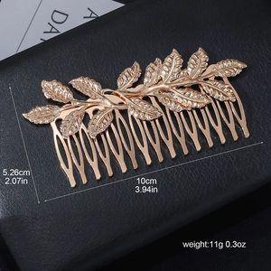 Elegant gold leaf hair comb for bridal styling with textured metallic alloy foliage design